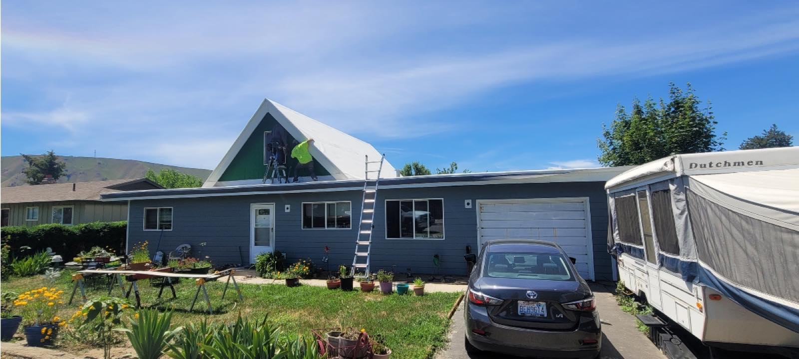 Two-story Yakima home with new gray siding, white trim and a new roof by Yakima Siding Pro